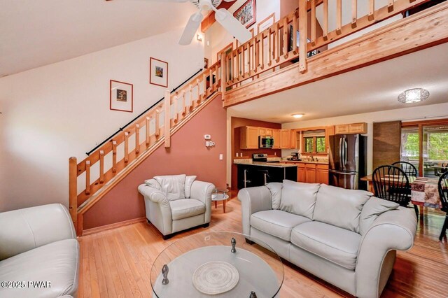 105 Chestnut Ct, Lackawaxen, PA 18435 - living area featuring high vaulted ceiling, light wood-style floors, stairs, and ceiling fan