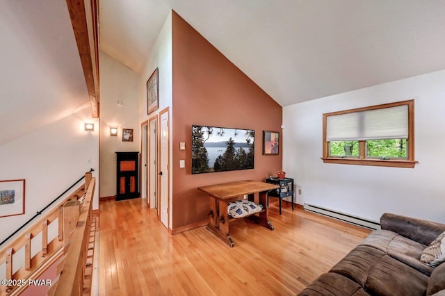 105 Chestnut Ct, Lackawaxen, PA 18435 - living area with baseboard heating, light wood-style floors, high vaulted ceiling, and baseboards