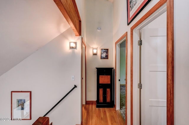 105 Chestnut Ct, Lackawaxen, PA 18435 - hall with light wood-style flooring, an upstairs landing, baseboards, and vaulted ceiling