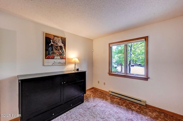105 Chestnut Ct, Lackawaxen, PA 18435 - carpeted bedroom with a baseboard heating unit, a textured ceiling, and baseboards