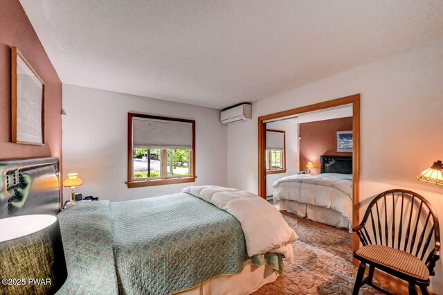 105 Chestnut Ct, Lackawaxen, PA 18435 - bedroom featuring a wall mounted AC and carpet flooring