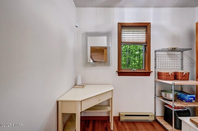 105 Chestnut Ct, Lackawaxen, PA 18435 - interior space featuring a baseboard radiator, wood finished floors, and baseboards