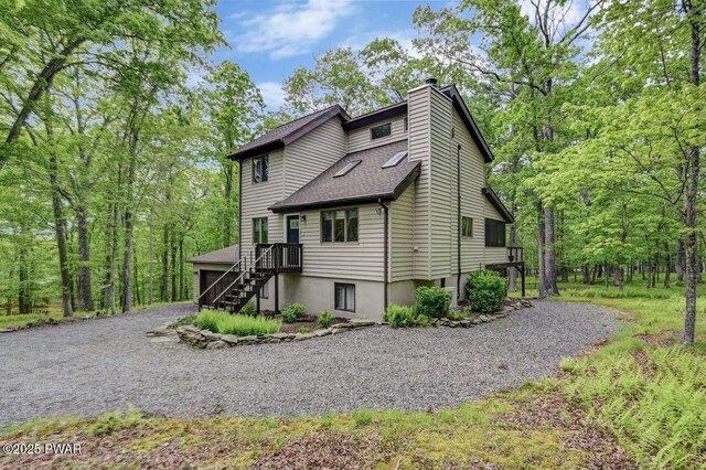 105 Chestnut Ct, Lackawaxen, PA 18435 - view of side of home featuring driveway, a chimney, and roof with shingles