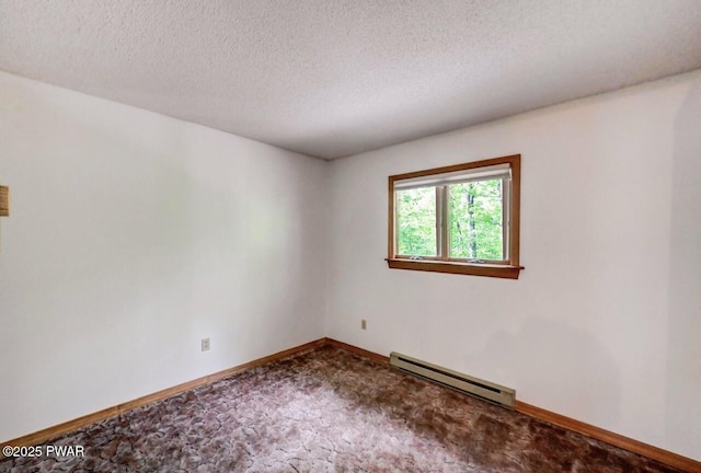 105 Chestnut Ct, Lackawaxen, PA 18435 - empty room featuring a baseboard radiator, carpet floors, baseboards, and a textured ceiling