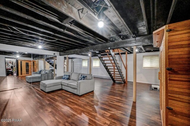 105 Chestnut Ct, Lackawaxen, PA 18435 - basement featuring stairway, wood finished floors, baseboard heating, and baseboards