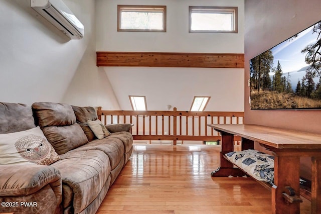 105 Chestnut Ct, Lackawaxen, PA 18435 - living room with a wall mounted AC, wood finished floors, and beam ceiling