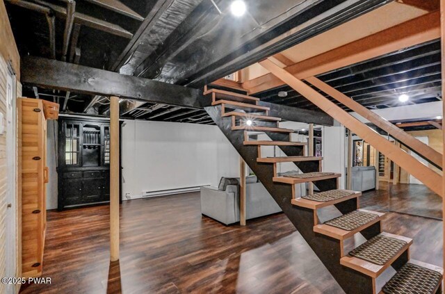 105 Chestnut Ct, Lackawaxen, PA 18435 - finished basement with a baseboard heating unit, stairway, and wood finished floors