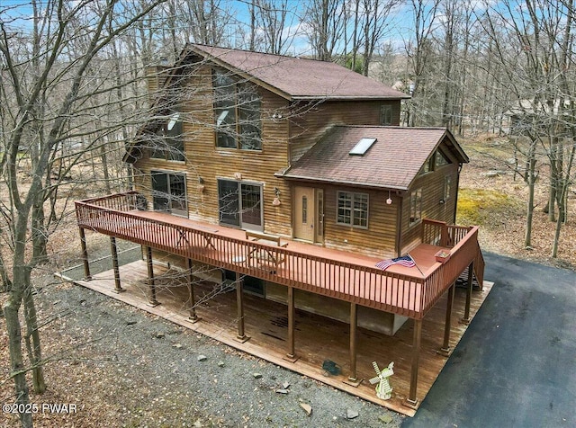 106 Alder Ln, Greentown, PA 18426 - rear view of house featuring roof with shingles and a wooden deck