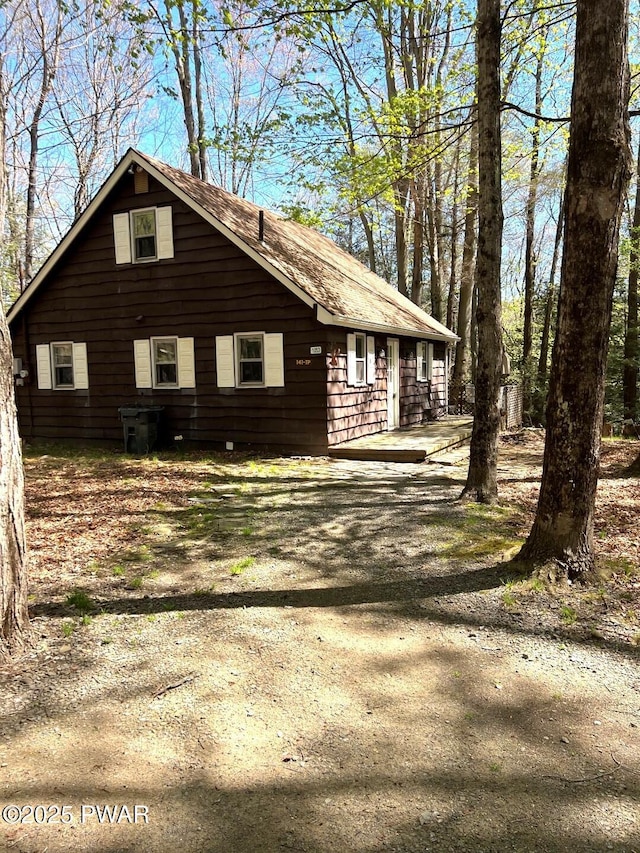 view of property exterior with driveway