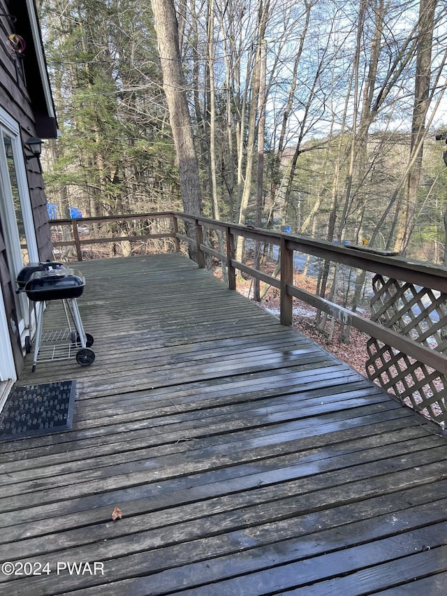 deck featuring a grill