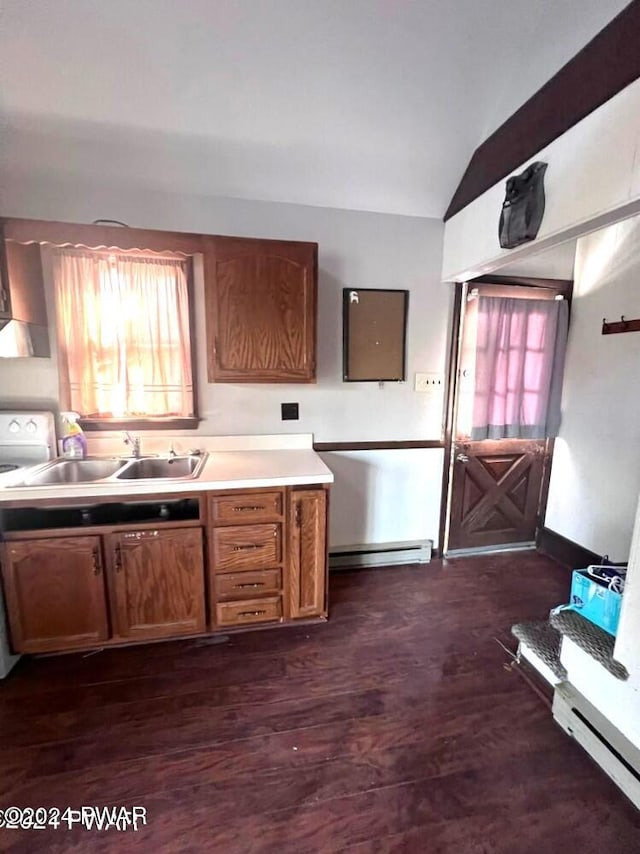 kitchen featuring lofted ceiling, dark wood-type flooring, a baseboard heating unit, sink, and range