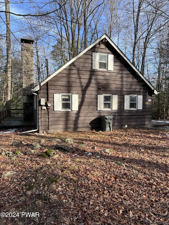 1053 Ledgedale Rd, Lake Ariel, PA 18436 - view of home's exterior featuring a chimney and a wooden deck