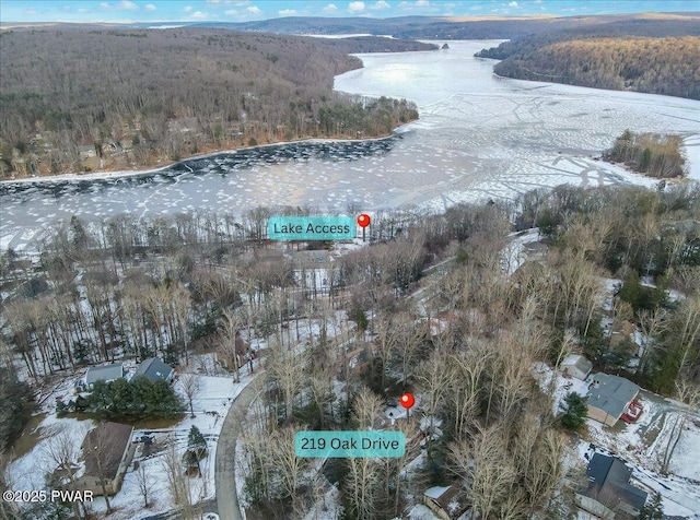 snowy aerial view with a mountain view