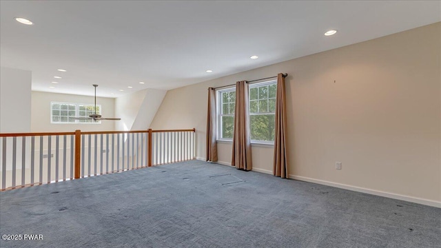 carpeted spare room with a ceiling fan, recessed lighting, and baseboards