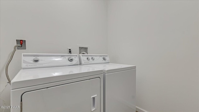 washroom featuring laundry area and washer and clothes dryer