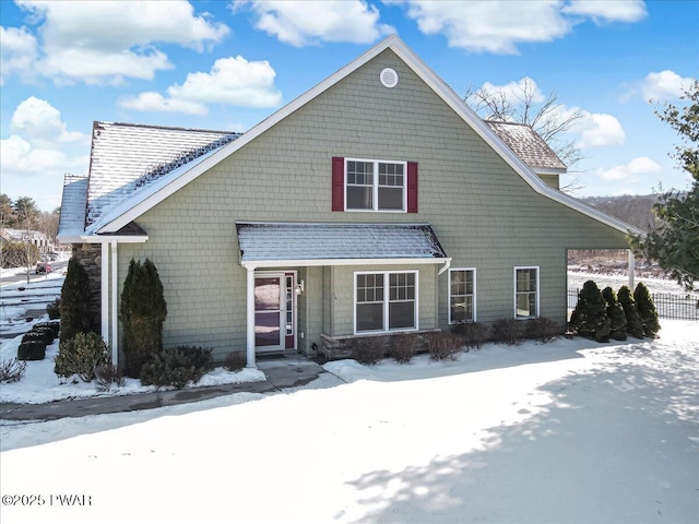 view of front of home featuring roof with shingles