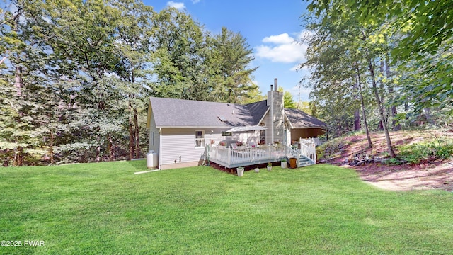 785 Milford Rd, Dingmans Ferry, PA 18328 - rear view of property featuring a lawn, a deck, and a chimney