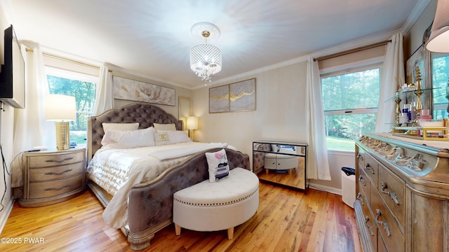 785 Milford Rd, Dingmans Ferry, PA 18328 - bedroom with light wood-type flooring, multiple windows, crown molding, and a chandelier