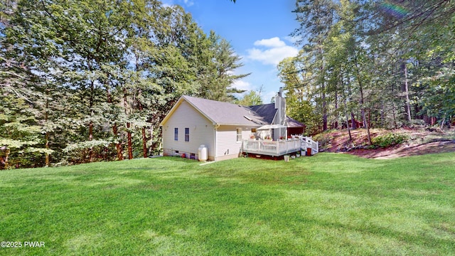 785 Milford Rd, Dingmans Ferry, PA 18328 - rear view of house featuring a chimney, a deck, and a yard