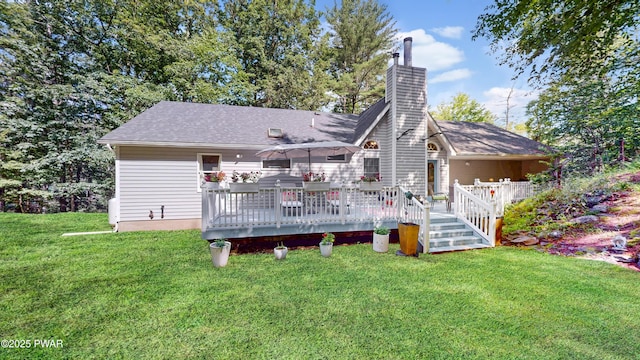 785 Milford Rd, Dingmans Ferry, PA 18328 - back of house with a wooden deck, a chimney, a yard, and a shingled roof
