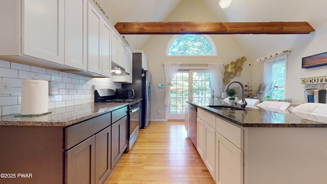 785 Milford Rd, Dingmans Ferry, PA 18328 - kitchen with range with gas cooktop, light wood-style flooring, dishwasher, backsplash, and white cabinets