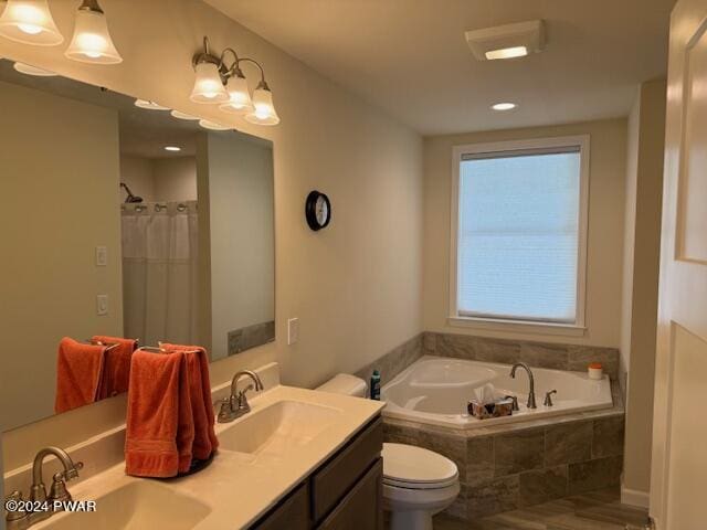 full bathroom with vanity, a healthy amount of sunlight, toilet, and separate shower and tub