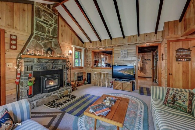 25 Deerfoot Rd, Lake Ariel, PA 18436 - carpeted living area featuring wooden walls, a fireplace, beamed ceiling, heating unit, and high vaulted ceiling