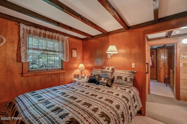 25 Deerfoot Rd, Lake Ariel, PA 18436 - carpeted bedroom featuring beam ceiling and wooden walls