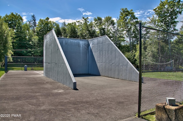 view of outbuilding featuring fence