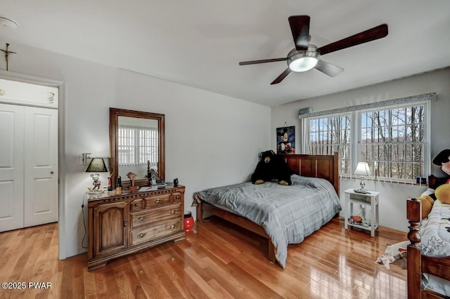 bedroom featuring ceiling fan and light wood finished floors