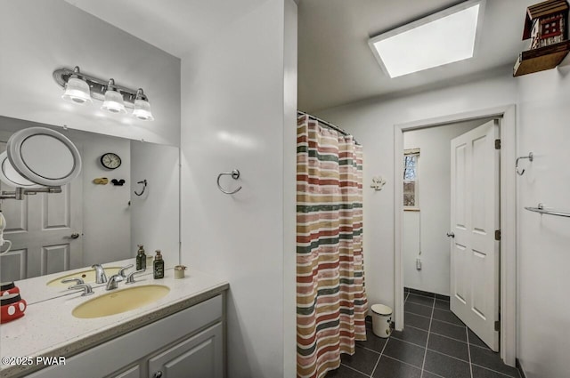 bathroom featuring tile patterned flooring, vanity, and a shower with curtain