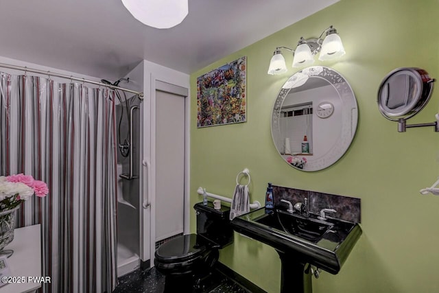 full bath with a shower with shower curtain and toilet