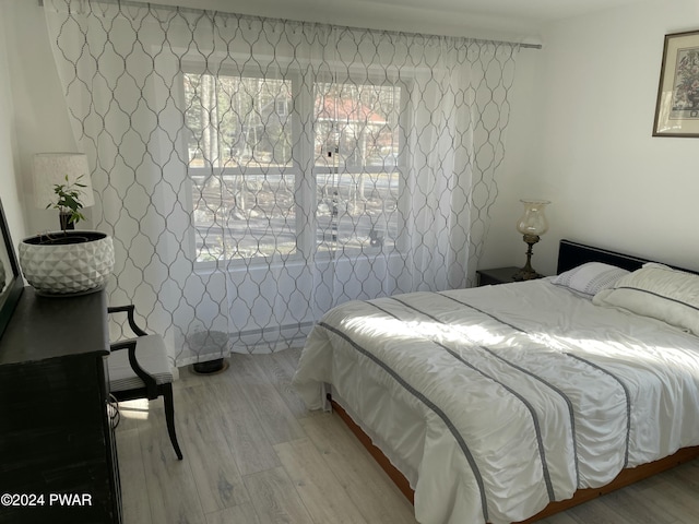 bedroom with light wood-type flooring