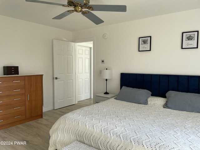 bedroom featuring ceiling fan and light hardwood / wood-style flooring