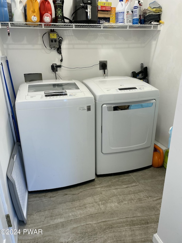 laundry room featuring separate washer and dryer