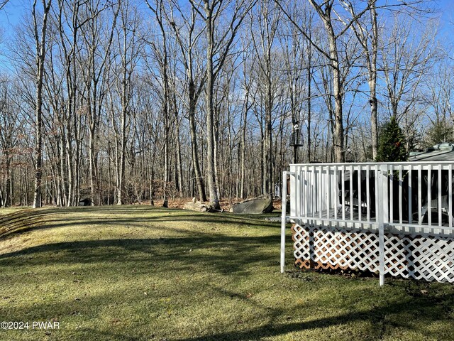 view of yard with a wooden deck