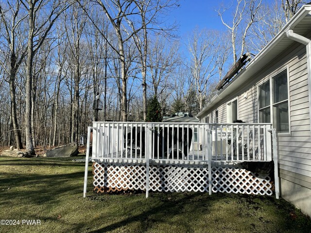 wooden terrace with a yard