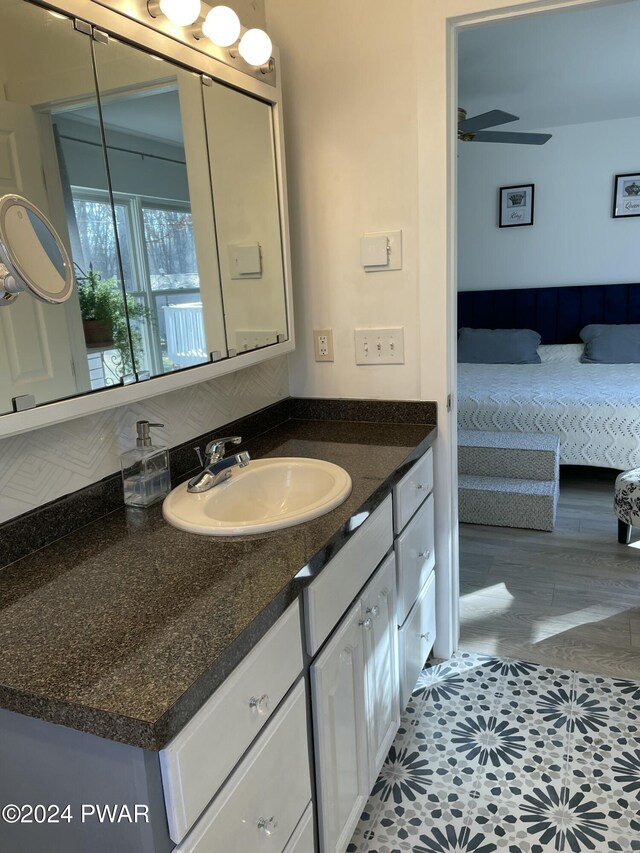 bathroom featuring ceiling fan, tile patterned flooring, and vanity