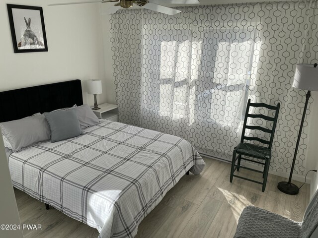 bedroom with hardwood / wood-style floors