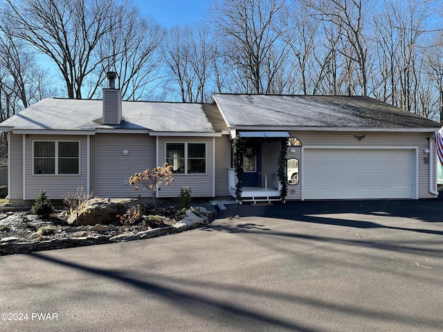 single story home with a garage