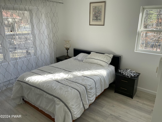 bedroom featuring light wood-type flooring