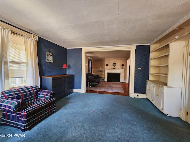 unfurnished room featuring built in shelves, a fireplace, and carpet