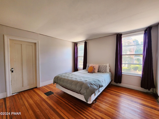 bedroom featuring hardwood / wood-style flooring