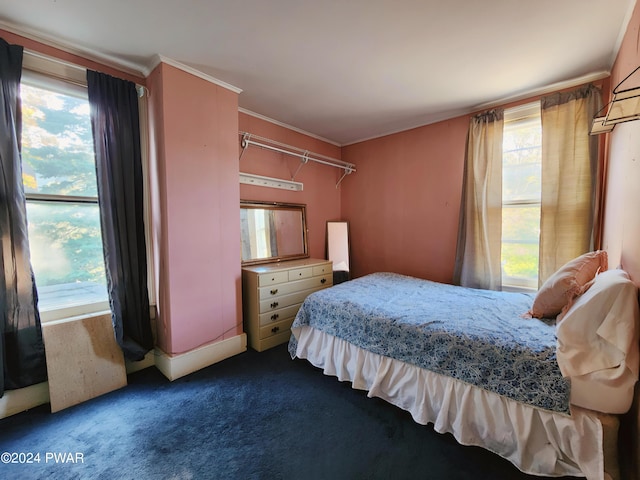 carpeted bedroom featuring ornamental molding