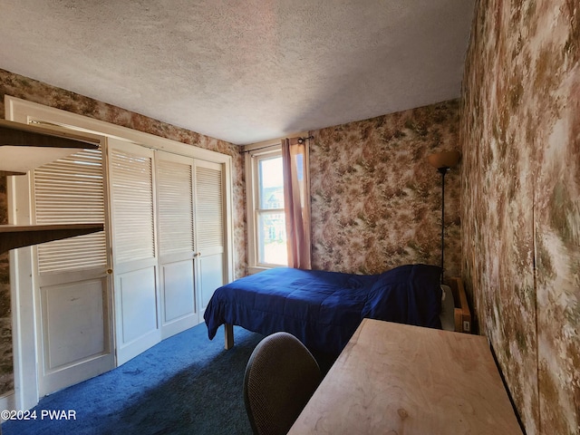 carpeted bedroom featuring a textured ceiling