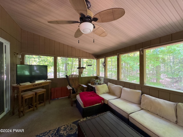 sunroom / solarium with ceiling fan, wood ceiling, and lofted ceiling