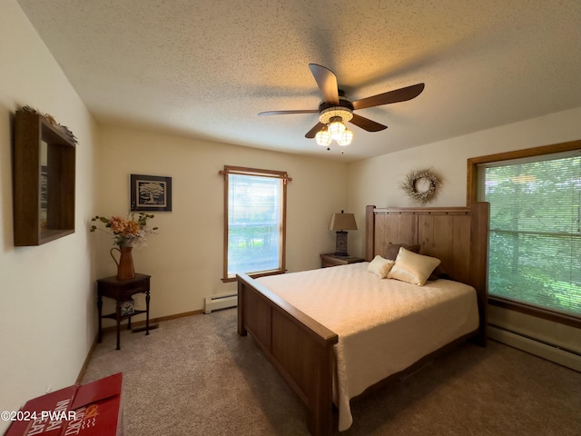 carpeted bedroom featuring ceiling fan, a baseboard radiator, and a textured ceiling