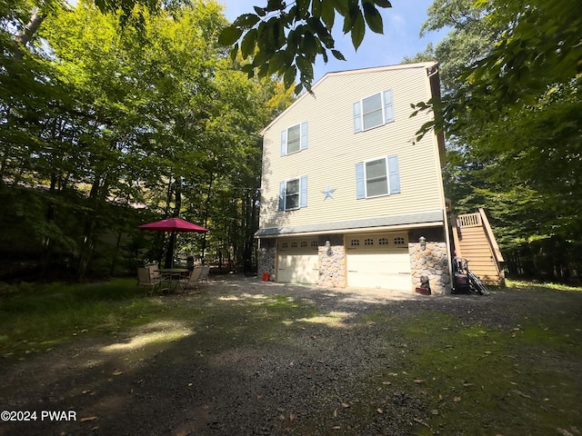 view of property exterior featuring a garage