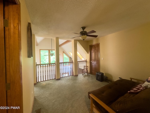 carpeted living room with a textured ceiling, ceiling fan, and lofted ceiling