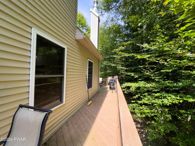 view of property exterior with a deck